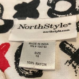 North style button down top with buttons on the sleeves size 1x